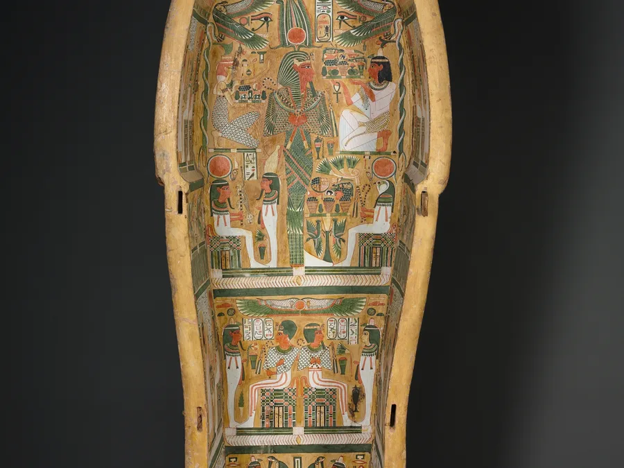 Painted Egyptian coffin base of Bakenmut with funerary imagery and inscriptions.