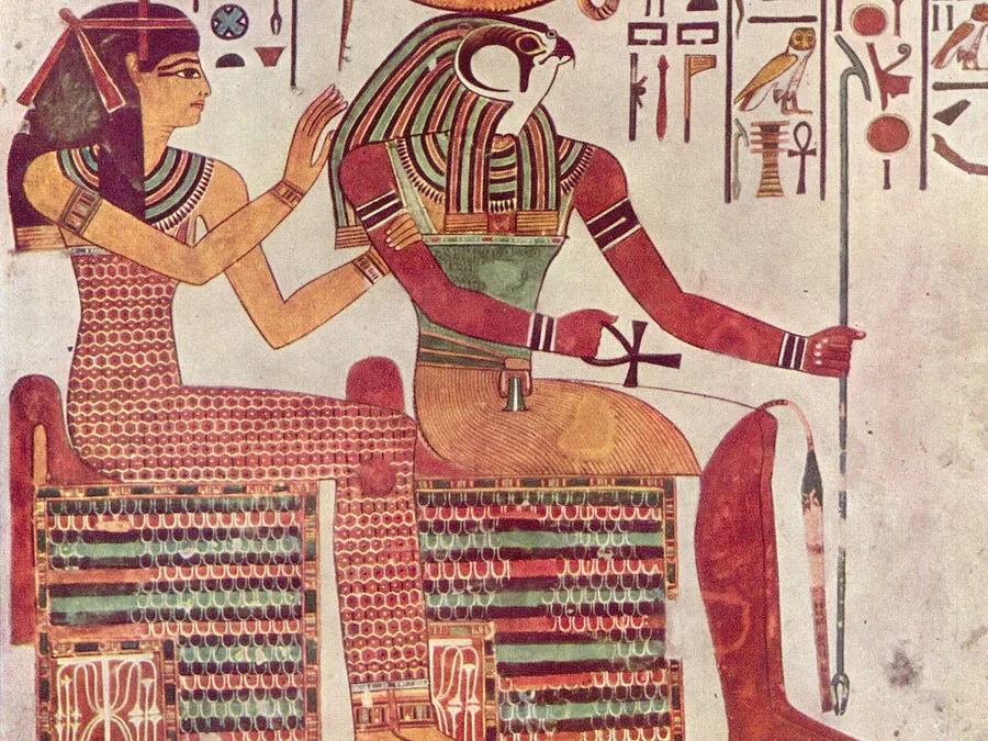 Egyptian tomb painting of a falcon-headed god with a red sun disk enthroned beside a goddess.