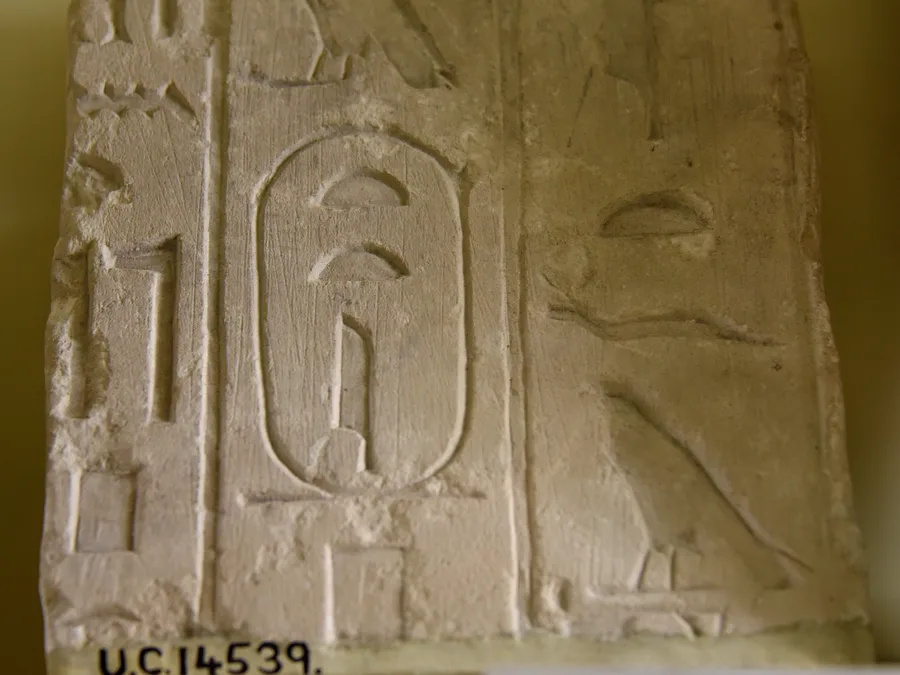 Limestone fragment from the Pyramid of Teti with carved Egyptian hieroglyphic Pyramid Texts and cartouche.