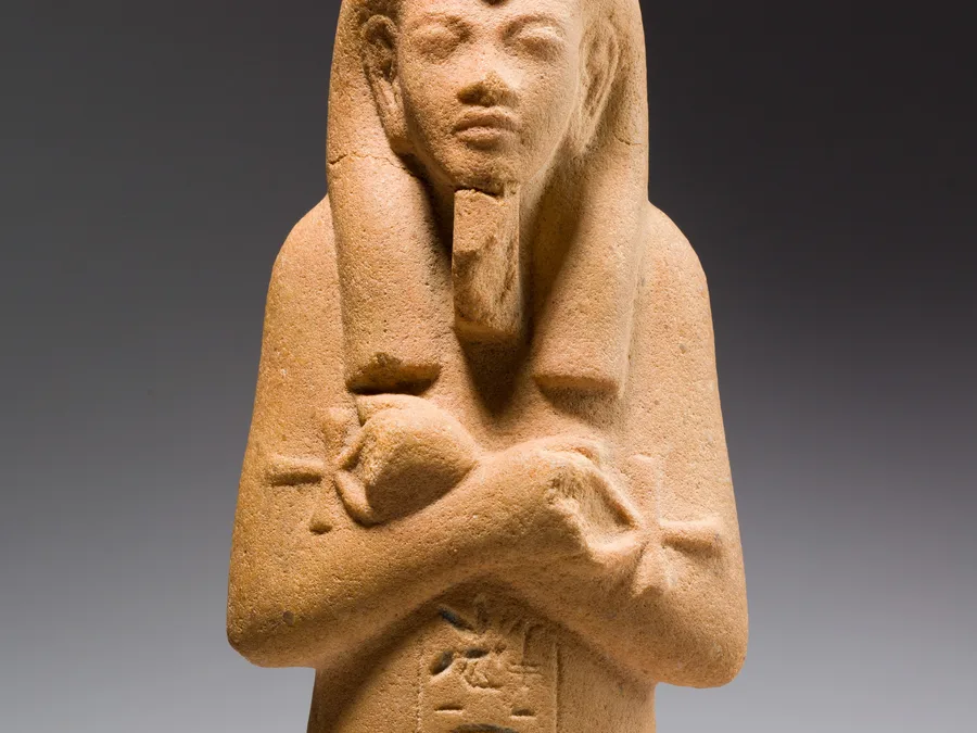 Brown quartzite Egyptian funerary figure of Akhenaten.