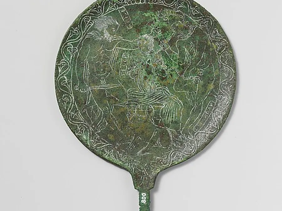 Engraved bronze mirror depicting Odysseus and Circe.