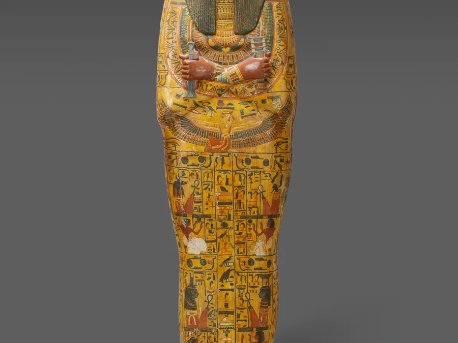 Painted Egyptian inner coffin of Khonsu with hieroglyphs and funerary deity imagery.