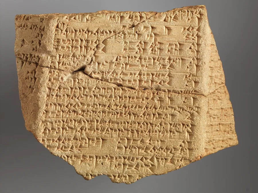 Babylonian clay prism fragment with cuneiform inscription from a kudurru-like object.