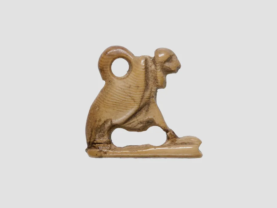 Small Egyptian vulture amulet in ivory or bone.